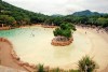 Pool with waves and sand beach in Lost City park, Sun City, South Africa