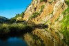 Lake next to a colorful cliff in Addo Elephant National Park