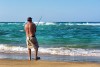 Old angler on sunset beach in Sodwana Bay, iSimangaliso Wetlands Park