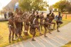 Traditional African dancers performing in tribal clothing and adornments